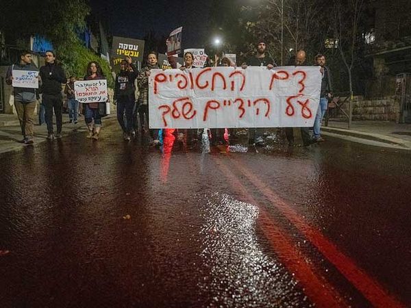 Demonstrators stage 'river of blood' outside of Netanyahu's home