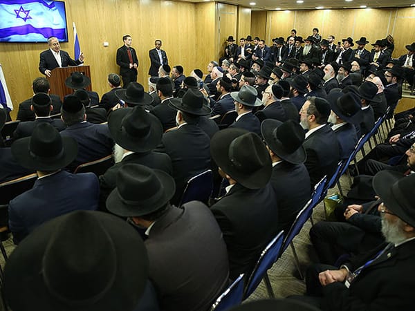 Coalition resumes push for Rabbinical bill amid opposition protests